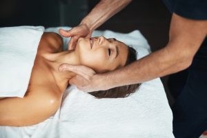 woman receiving professional healing body treatment